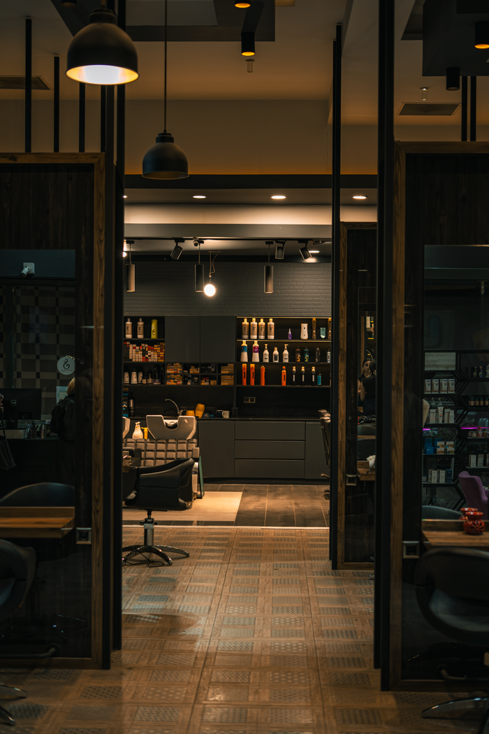 services-01 Elegant hair salon with contemporary design and inviting lighting ambience for a chic experience.
