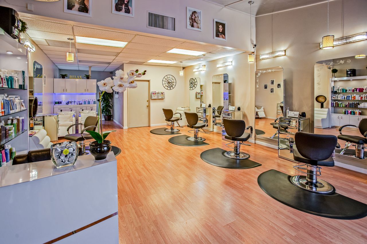 about-06 Spacious and stylish hair salon interior in Del Mar, CA showcasing chic design.